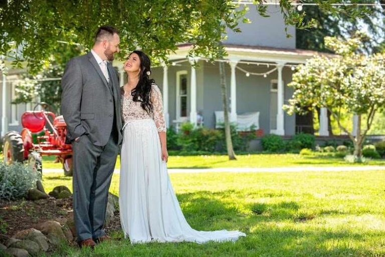 bride and groom by Glenwood Farmhouse in Durham CA